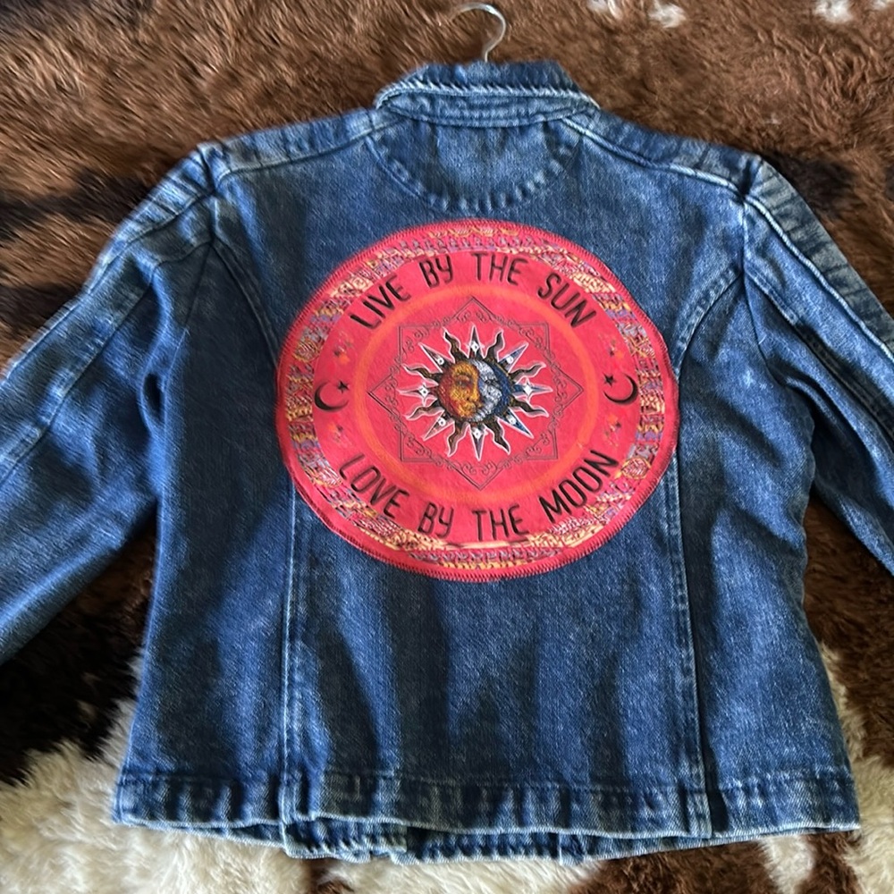 Upcycled denim biker style jacket. Live by the sun patch on back